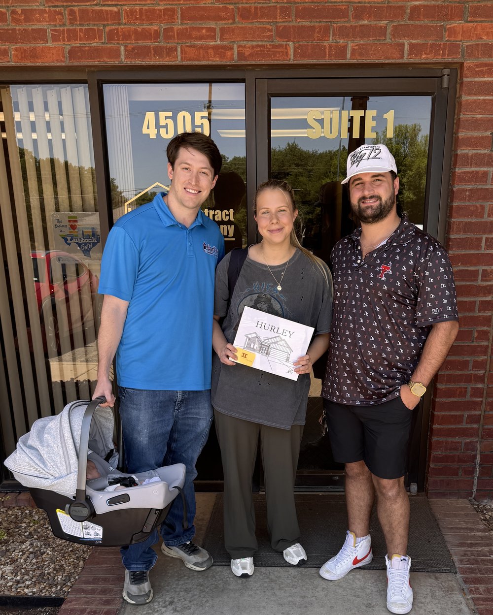 John Thomasson II with clients at their Lubbock home closing